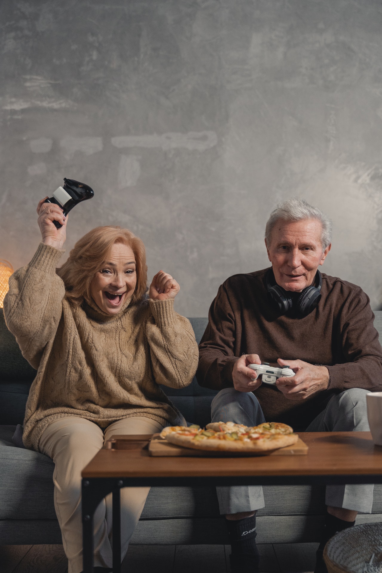 Two persons having fun playing on a console